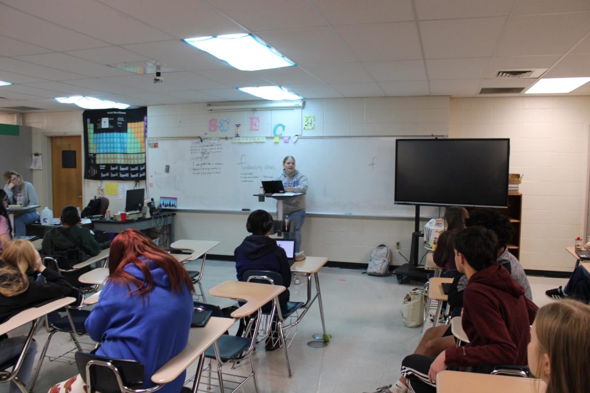 DHS Pep Club students participating in a club discussion.